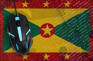 Grenada flag  and computer mouse. Digital threat, illegal actions on the Internet photo
