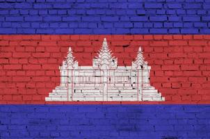 Cambodia flag is painted onto an old brick wall photo