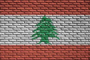 Lebanon flag is painted onto an old brick wall photo