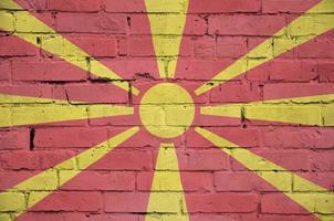 Macedonia flag is painted onto an old brick wall photo