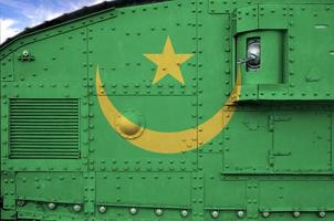 Mauritania flag depicted on side part of military armored tank closeup. Army forces conceptual background photo