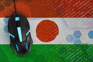 Niger flag  and computer mouse. Digital threat, illegal actions on the Internet photo