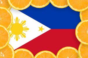 Philippines flag  in fresh citrus fruit slices frame photo