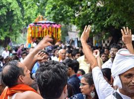 New Delhi, India July 01 2022 - A huge gathering of devotees from different parts of Delhi on the occasion of ratha yatra or rathyatra. Rath for Lord Jagannath pulled by people, Jagannath Rath Yatra photo