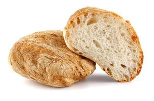 Ciabatta, loaf of bread cut in half isolated on white background. photo