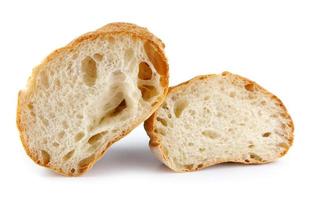 Ciabatta, loaf of bread cut in half isolated on white background. photo