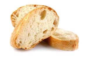 Ciabatta, loaf of bread cut in half isolated on white background. photo