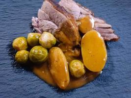 Roast turkey with Brussels sprouts potatoes and gravy photo