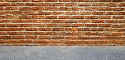 Brown or red brick wall with grey or gray floor for background. Line pattern and grunge, rough wallpaper. Building and Construction. Loft exterior design and copy space. photo