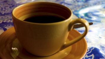 Glass Cup of black coffee in a restaurant Phuket Thailand. video