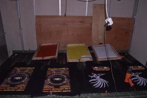 gresik, june, 2022 - manual screen printing studio with table and screen printing equipment photo