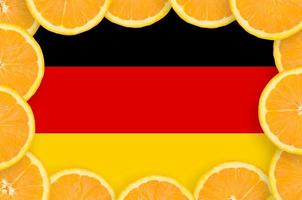 Germany flag  in fresh citrus fruit slices frame photo