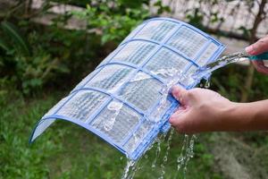 cleaning air conditioner dirty filter photo