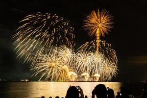 fireworks celebration over sea in pattaya beach photo