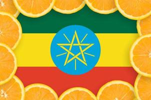 Ethiopia flag  in fresh citrus fruit slices frame photo