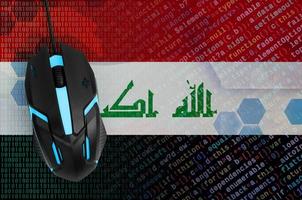 Iraq flag  and computer mouse. Digital threat, illegal actions on the Internet photo