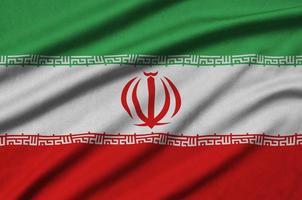 Iran flag  is depicted on a sports cloth fabric with many folds. Sport team banner photo