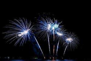 fireworks celebration over sea on pattaya beach photo