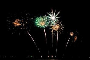 fireworks celebration over sea on pattaya beach photo