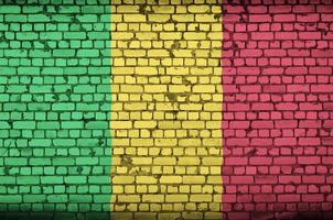 Mali flag is painted onto an old brick wall photo