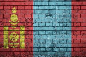 Mongolia flag is painted onto an old brick wall photo