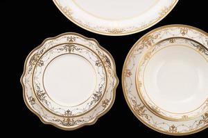 A luxury tableware set isolated on black background photo