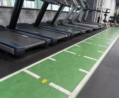 The row of treadmills in the sports complex photo
