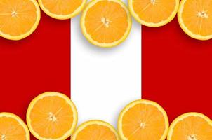 Peru flag  in citrus fruit slices horizontal frame photo