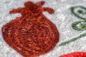 A closeup shot of national ornaments and patterns of Central Asia on a piece of cloth photo