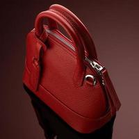 A closeup shot of a luxury red leather bag photo