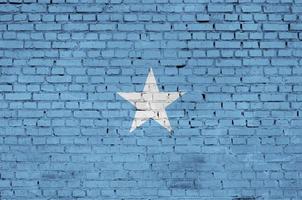 Somalia flag is painted onto an old brick wall photo