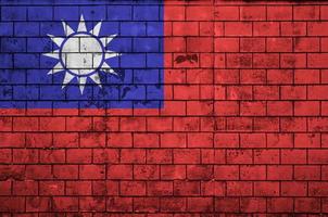 Taiwan flag is painted onto an old brick wall photo