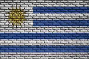 Uruguay flag is painted onto an old brick wall photo