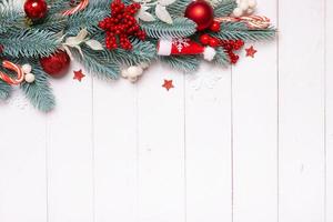 Christmas composition made from pine tree, stars and festive decorations top view. Christmas flat lay photo