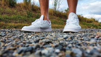 Closeup of feet in white shoes 2 photo