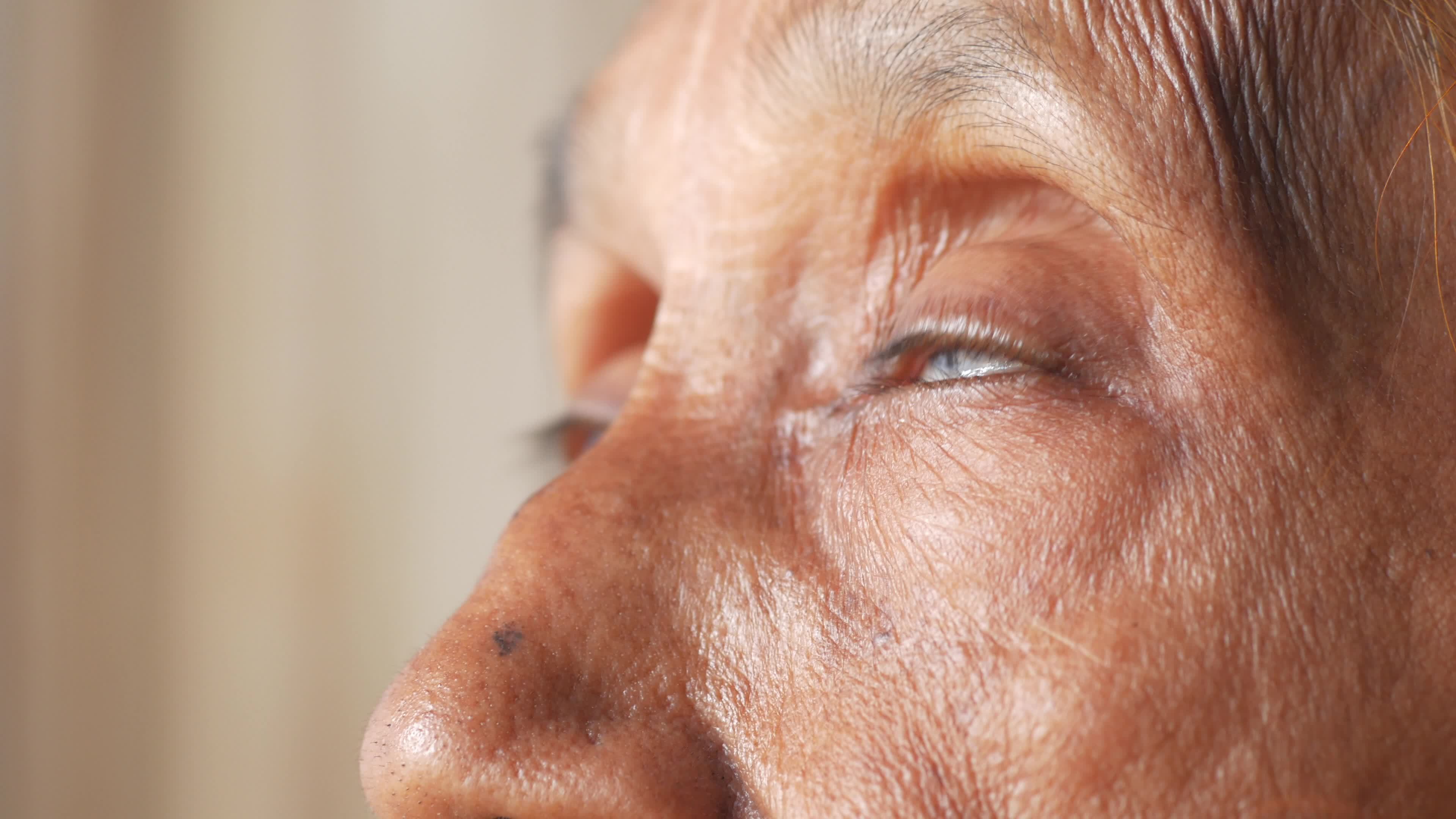 Close up on blinking eyes of an elderly person 13286157 Stock Video at