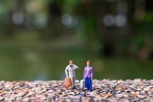 Couple strolling down the street  has a background of greenery photo