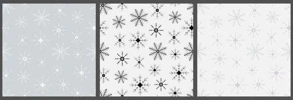 Set of seamless patterns with snowflakes. Hand drawn winter backgrounds. Doodle Christmas snowflakes vector print