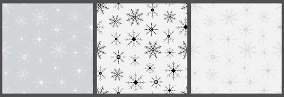 Set of seamless patterns with snowflakes. Hand drawn winter backgrounds. Doodle Christmas snowflakes vector print