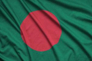 Bangladesh flag  is depicted on a sports cloth fabric with many folds. Sport team banner photo