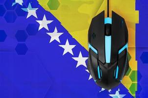 Bosnia and Herzegovina flag  and computer mouse. Concept of country representing e-sports team photo