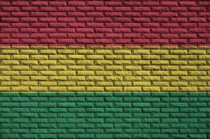 Bolivia flag is painted onto an old brick wall photo