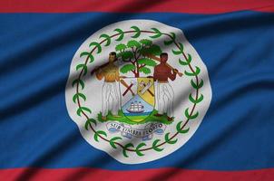 Belize flag  is depicted on a sports cloth fabric with many folds. Sport team banner photo