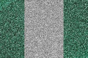 Nigeria flag depicted on many small shiny sequins. Colorful festival background for party photo
