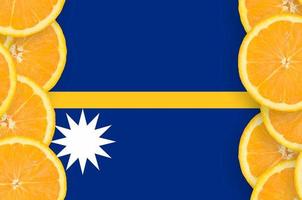 Nauru flag  in citrus fruit slices vertical frame photo