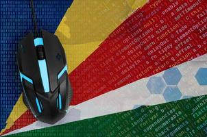Seychelles flag  and computer mouse. Digital threat, illegal actions on the Internet photo