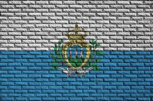 San Marino flag is painted onto an old brick wall photo