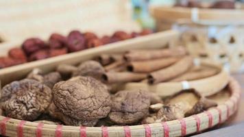 Dried mushrooms cinnamon sticks displayed in wicker platter video