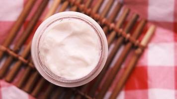 Overhead close up panning view of skin care container of cream moisturizer video