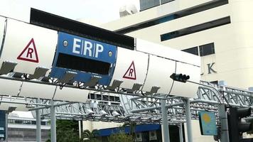 ERP gantry sign in Singapore, Electronic Road pricing System which charges motorists a fee during busy times to help stop congestion video